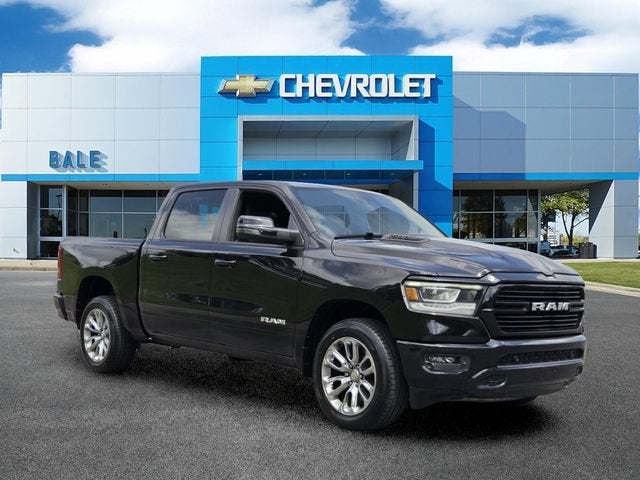2023 RAM 1500 Laramie in Black — front three-quarter view