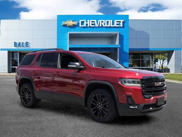 2023 GMC Acadia SLE in Volcanic Red Tintcoat — front three-quarter view