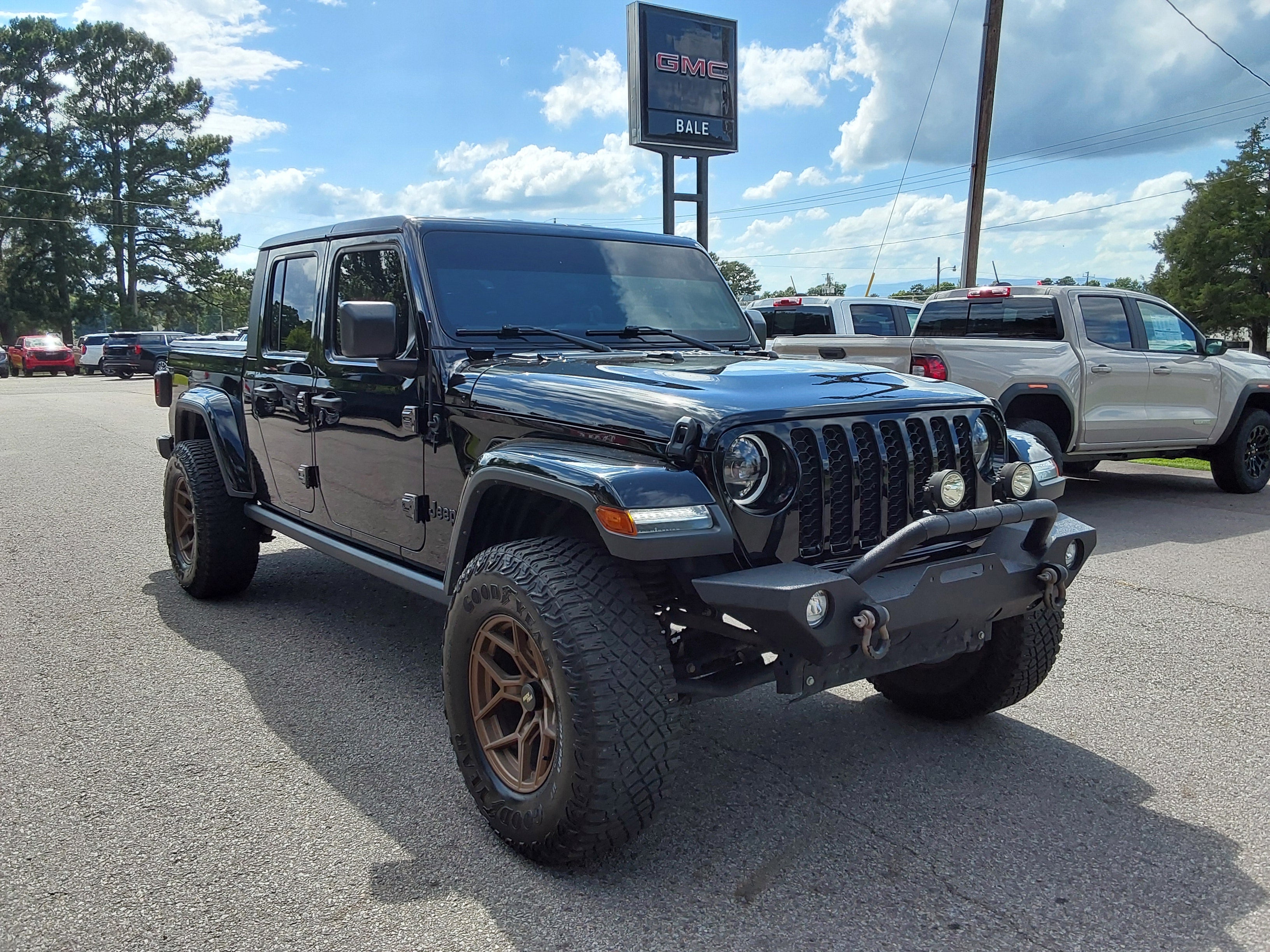 2023 Jeep Gladiator Sport S in Black — front three-quarter view