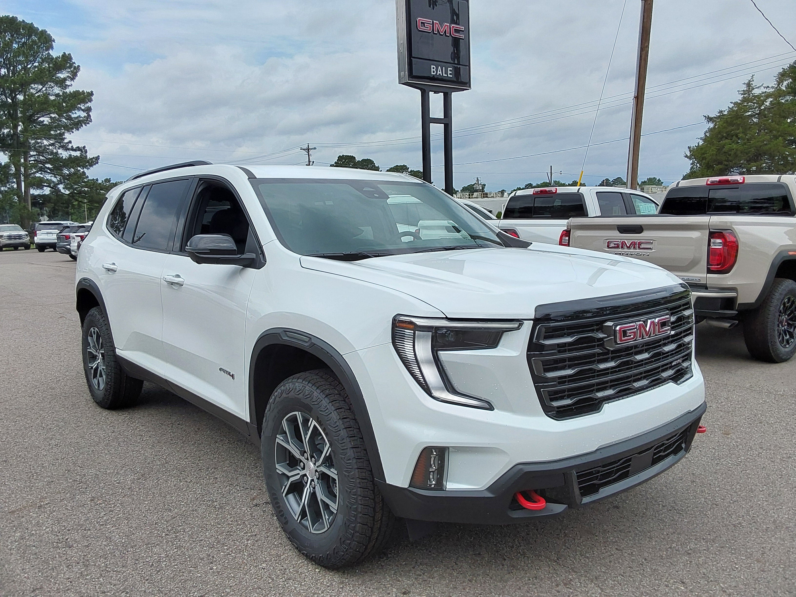 2026 GMC Acadia AT4 in Summit White — front three-quarter view