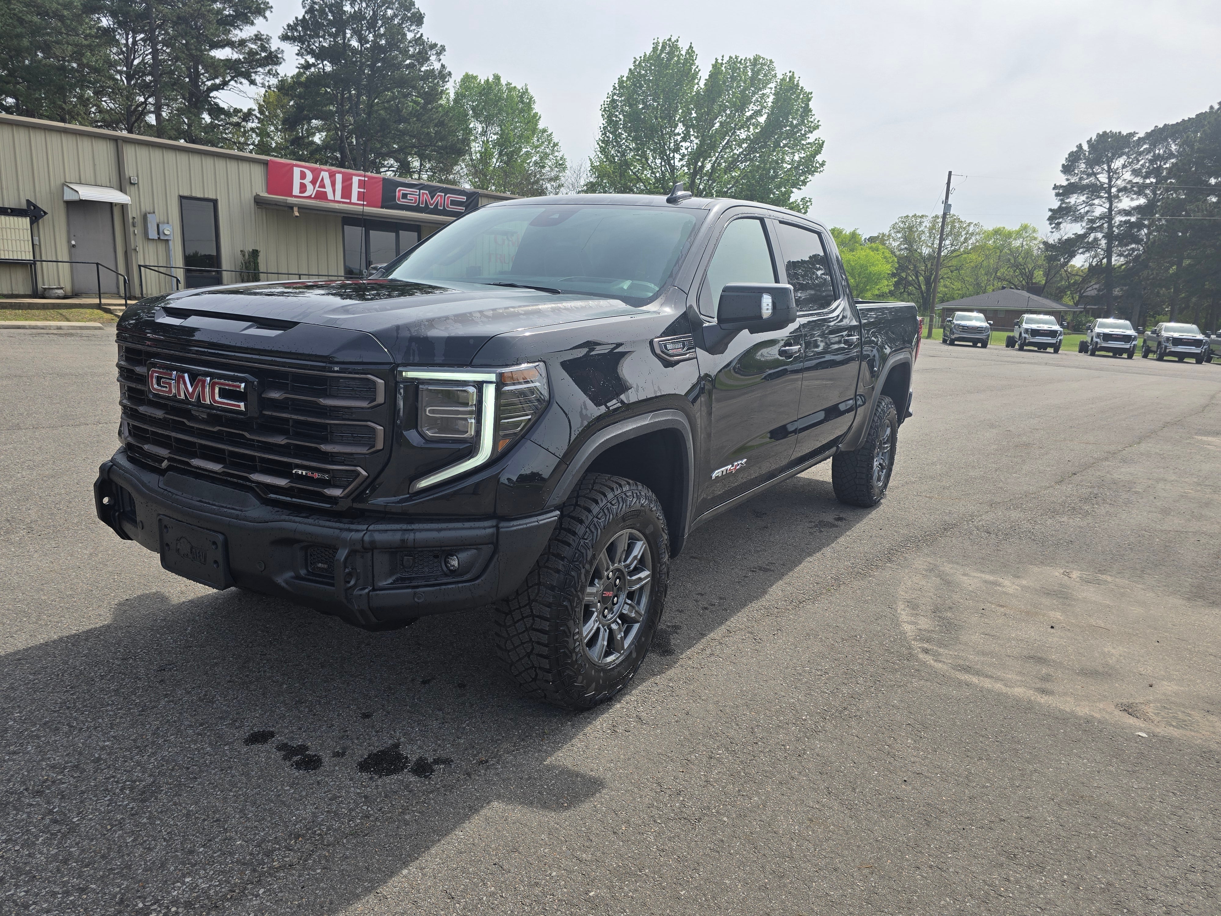 2026 GMC Sierra 1500 AT4X in Onyx Black — front three-quarter view